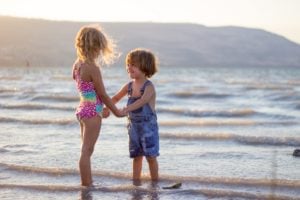 two children beach joy